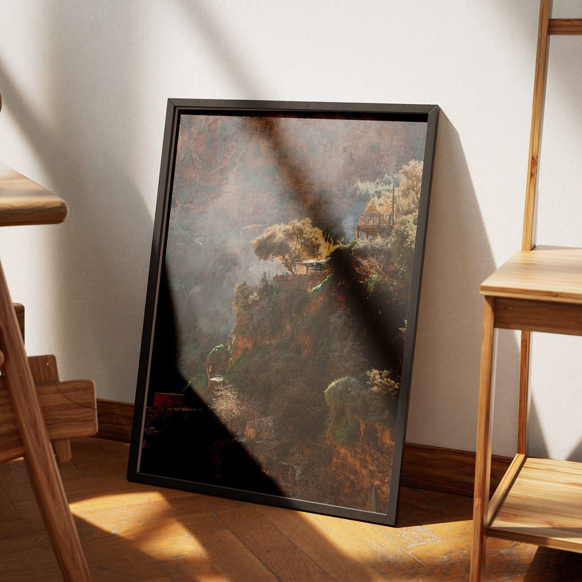 Cliffside Village - Travel Photography poster, leaning on the floor beside a chair